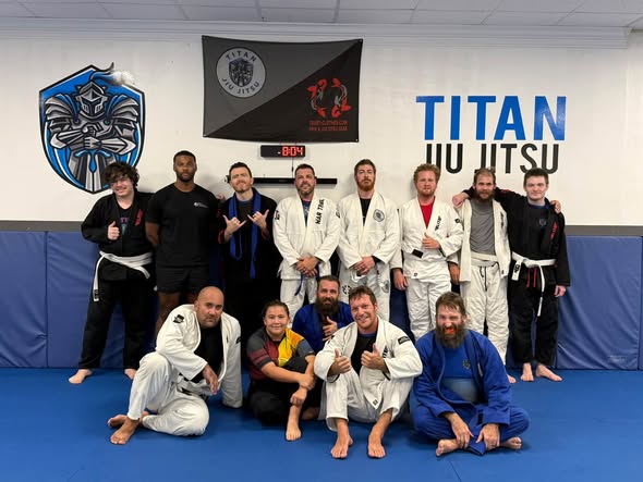 Titan adult Jiu-Jitsu students together after class