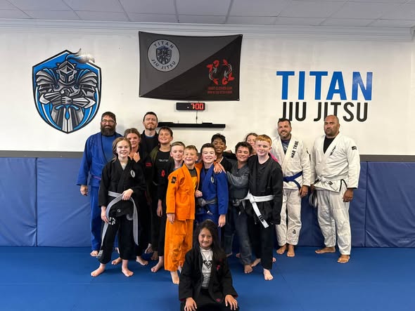Titan youth Jiu-Jitsu class with coaches on the mats