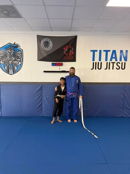 Young Titan student after earning a new belt